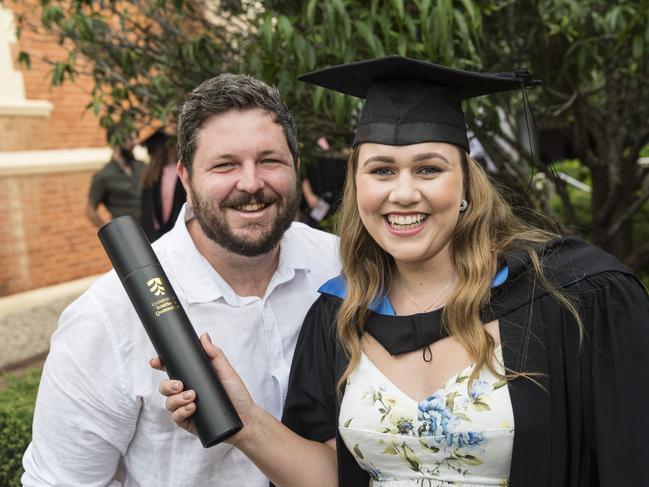 Bachelor of Biomedical Science graduate Lauren Stuart with husband Brendan Stuart at a UniSQ graduation ceremony at Empire Theatres, Tuesday, February 13, 2024. Picture: Kevin Farmer