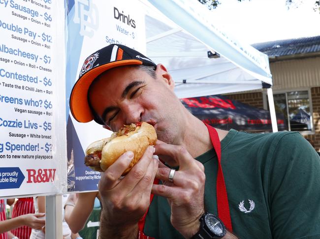DAILY TELEGRAPH MAY 3, 2025. Andrew Linn who is helping out at the sausage sizzle at Double Bay Public School on Election Day. The menu includes The Pork Barrell, Double Bay Double Pay, Albacheesy and Greens who? Picture: Jonathan Ng