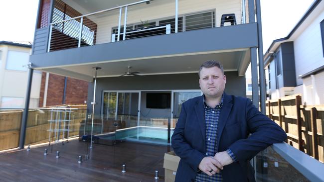 David Adams at his unfinished home at Wavell Heights. Pic Annette Dew