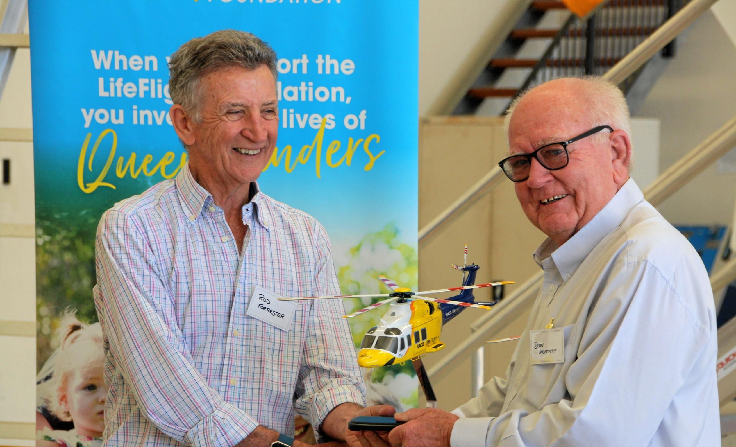 LifeFlight director Rod Forrester makes a presentation to Don Moffatt. Picture: erle levey