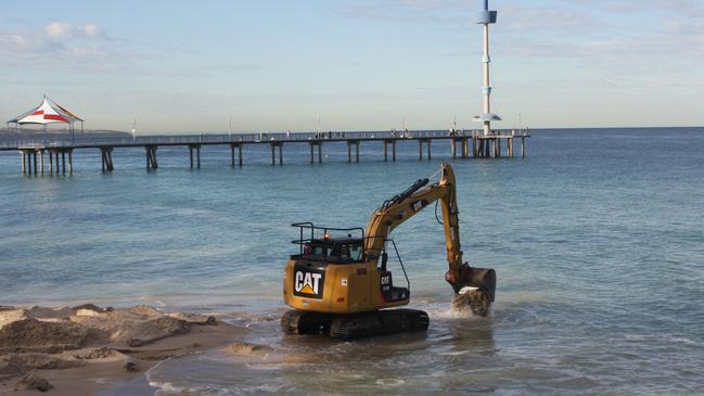 Sandbag groynes being installed at Brighton beach. Picture: Eugene Boisvert