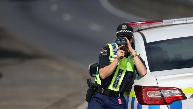 Easter Road Operation - Patrick Billings story.  Constable Brooke Johnson and Constable John Barwick of Tasmania Police checking driver's speed on the Brooker Highway at New Town.PICS: MATT THOMPSON