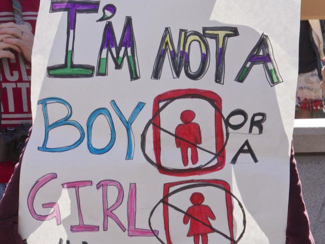 Asheville, North Carolina, USA - April 2, 2016:  Close up of a sign about bathroom use at a HB2 protest rally of the new NC law which denies rights to those who are gay or transgender on April 2, 2016 in downtown Asheville, NC