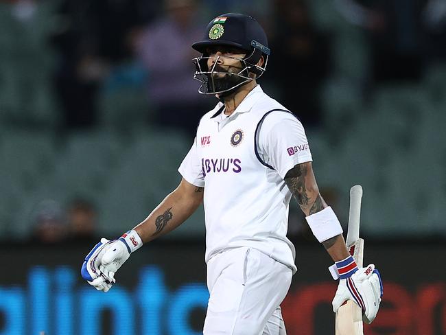 ADELAIDE, AUSTRALIA - DECEMBER 17: Virat Kohli of India walks off the field after being run-out by Josh Hazlewood of Australia during day one of the First Test match between Australia and India at Adelaide Oval on December 17, 2020 in Adelaide, Australia. (Photo by Ryan Pierse/Getty Images)