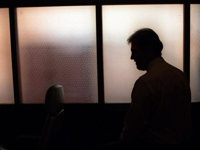 Generic image. Silhouette of a man (parent of) a sex abuse victim in an office. wrongly accused of touching young girl. Child sexual abuse. sex crime incest paedophilia.