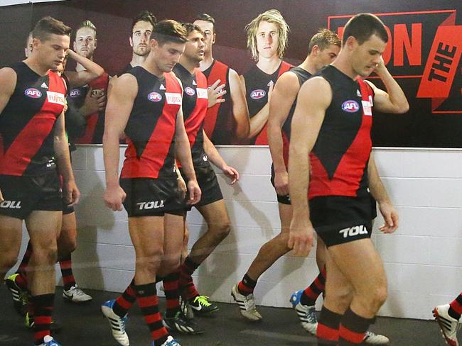 MELBOURNE, AUSTRALIA - JUNE 15:  The Bombers leave their changing room during the round 13 AFL match between the Essendon Bombers and the Melbourne Demons at the Melbourne Cricket Ground on June 15, 2014 in Melbourne, Australia.  (Photo by Scott Barbour/Getty Images)