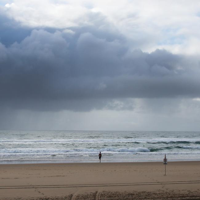Day three of the Gold Coast lockdown. Lone swimmer at Broadbeach.. Picture Glenn Hampson
