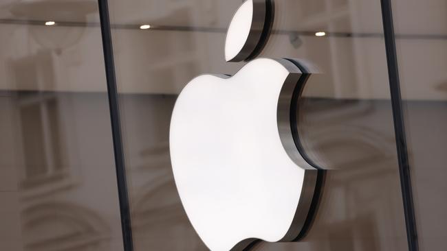 BERLIN, GERMANY - MARCH 25: The Apple logo hangs on an Apple Store on March 25, 2024 in Berlin, Germany. The European Commission is launching an investigation into Apple, Meta (the parent company of Facebook) and Alphabet (the parent company of Google) over whether the companies violate the new EU Digital Markets Act. (Photo by Sean Gallup/Getty Images)