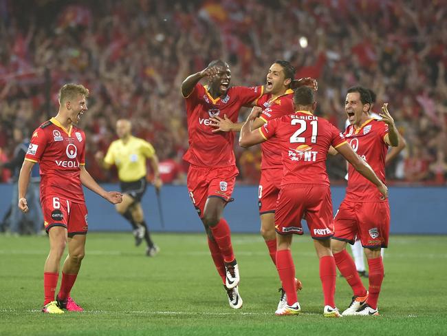 Adelaide United players react after winning the A-League grand final.