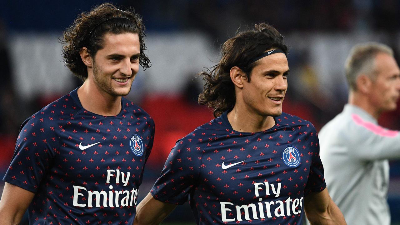 Paris Saint-Germain's French midfielder Adrien Rabiot (L) and Paris Saint-Germain's Uruguayan forward Edinson Cavani warm up