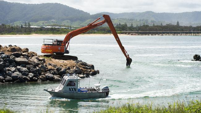 An excavator removing sand at the boat ramp in 2015. Photo Trevor Veale / Coffs Coast Advocate