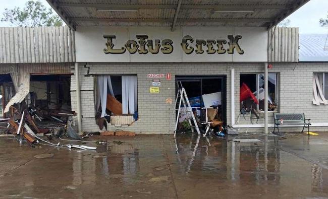 DESTROYED: Lotus Creek Service Station, north of Marlborough, was destroyed by raging floodwaters that swept through after Cyclone Debbie. INSET: Sandy Petrie with grandchildren Joseph and Claire Olsson. Picture: Contributed