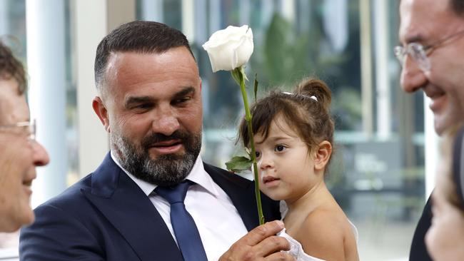 Danny Abdallah with his daughter at the Steps for Forgiveness event, The Botanical Gardens, Sydney. Picture: Damian Shaw