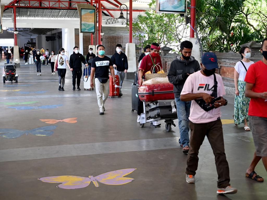 Passengers arrive at Ngurah Rai Airport on the first day of Bali’s reopening on Friday, local time. Picture: Sonny Tumbelaka/AFP