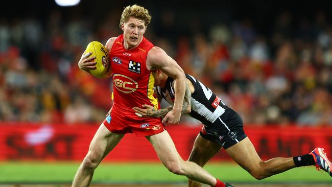 GOLD COAST, AUSTRALIA - JUNE 29: Matt Rowell of the Suns is tackled during the round 16 AFL match between Gold Coast Suns and Collingwood Magpies at People First Stadium, on June 29, 2024, in Gold Coast, Australia. (Photo by Chris Hyde/Getty Images)