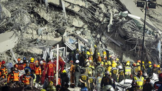 Rescue workers conduct a search and rescue operation for trapped people. Picture: Sirachai Arunrugstichai/Getty Images