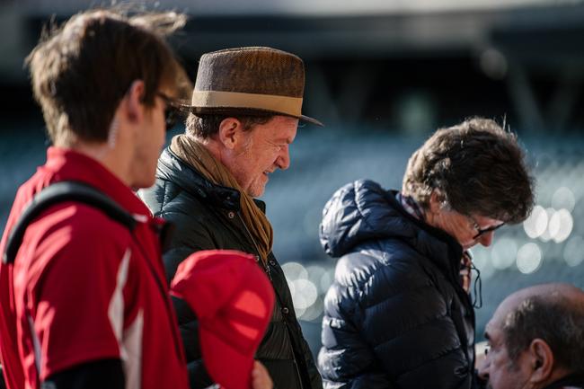 Director Mark Lamprell and Susie Struth are seen talking to actors in front of Crows and Port Adelaide fans. Picture: Morgan Sette/The Advertiser