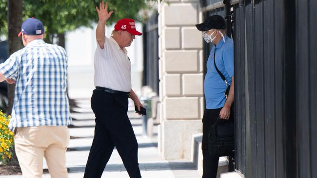 US President Donald Trump walks into the White House on Sunday after returning from a golf outing to his club in Virginia. Picture: AFP