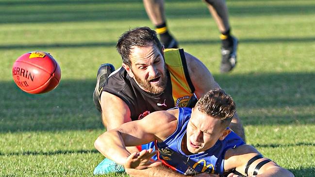 Goulburn Valley Football League season 2019. Round 11, June 22 at Seymour. Rochester 11.6 (72) d Seymour 6.11 (47). Rochester playing coach James Flaherty applies a big tackle on Seymour's Harrison Wade. Picture: AARON COOK