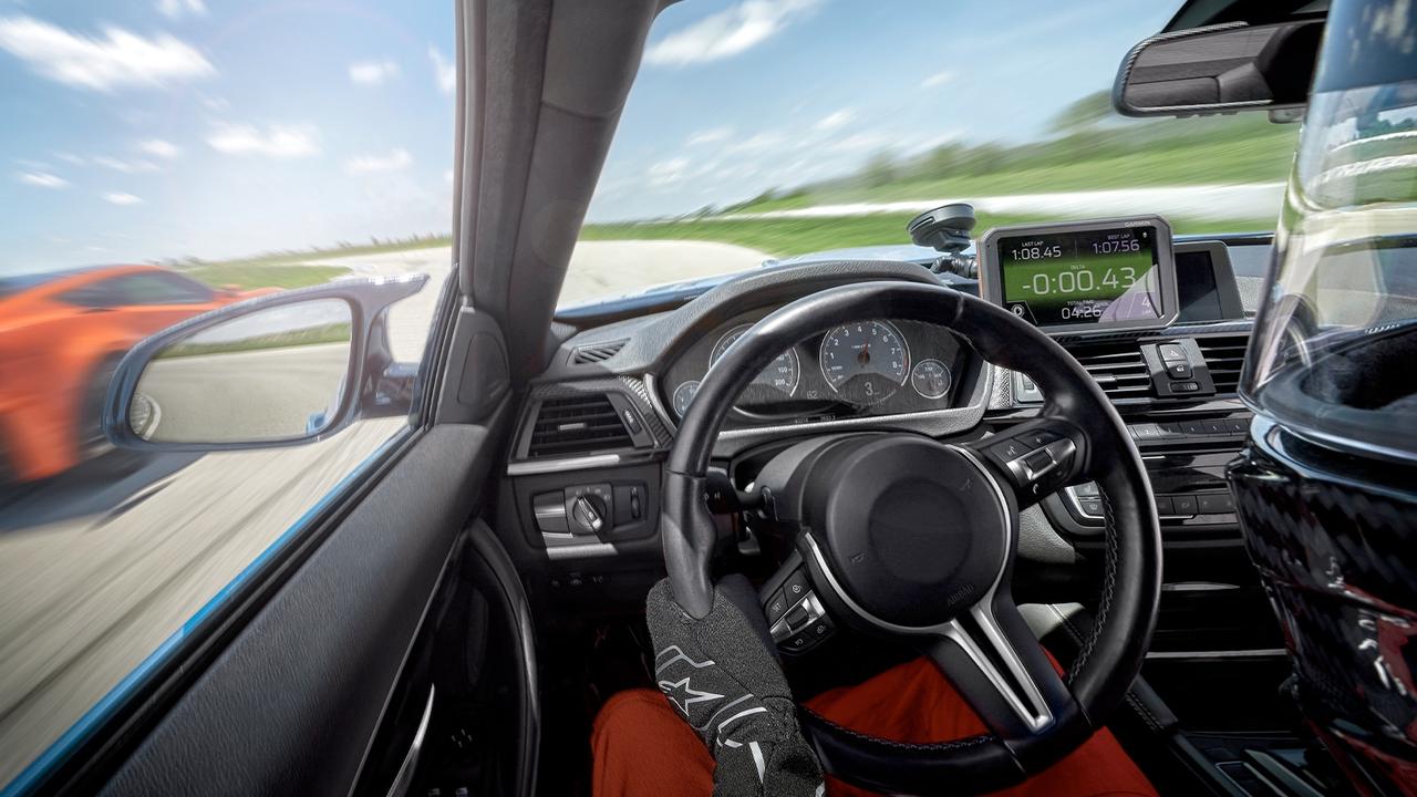 The dashboard-mounted Garmin Catalyst driving coach helps amateur drivers find speed.