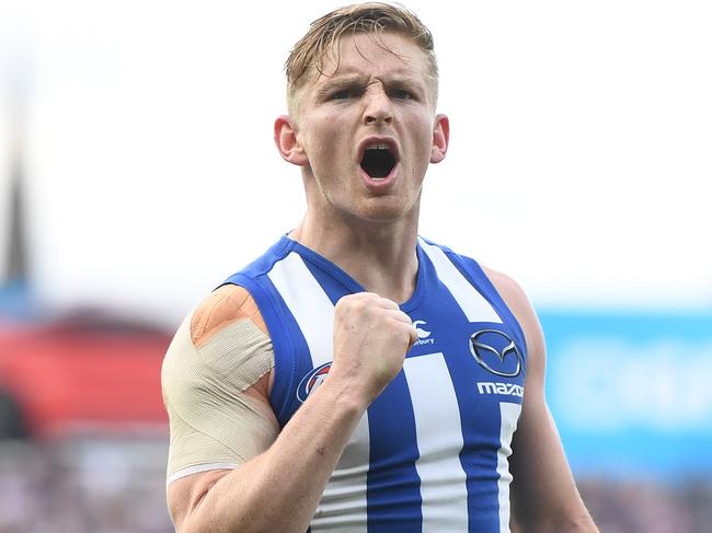 Jack Ziebell of the Kangaroos reacts after kicking a goal during the Round 12 AFL match between the Geelong Cats and the North Melbourne Kangaroos at GMHBA Stadium in Geelong, Saturday, June 9, 2018. (AAP Image/Julian Smith) NO ARCHIVING, EDITORIAL USE ONLY