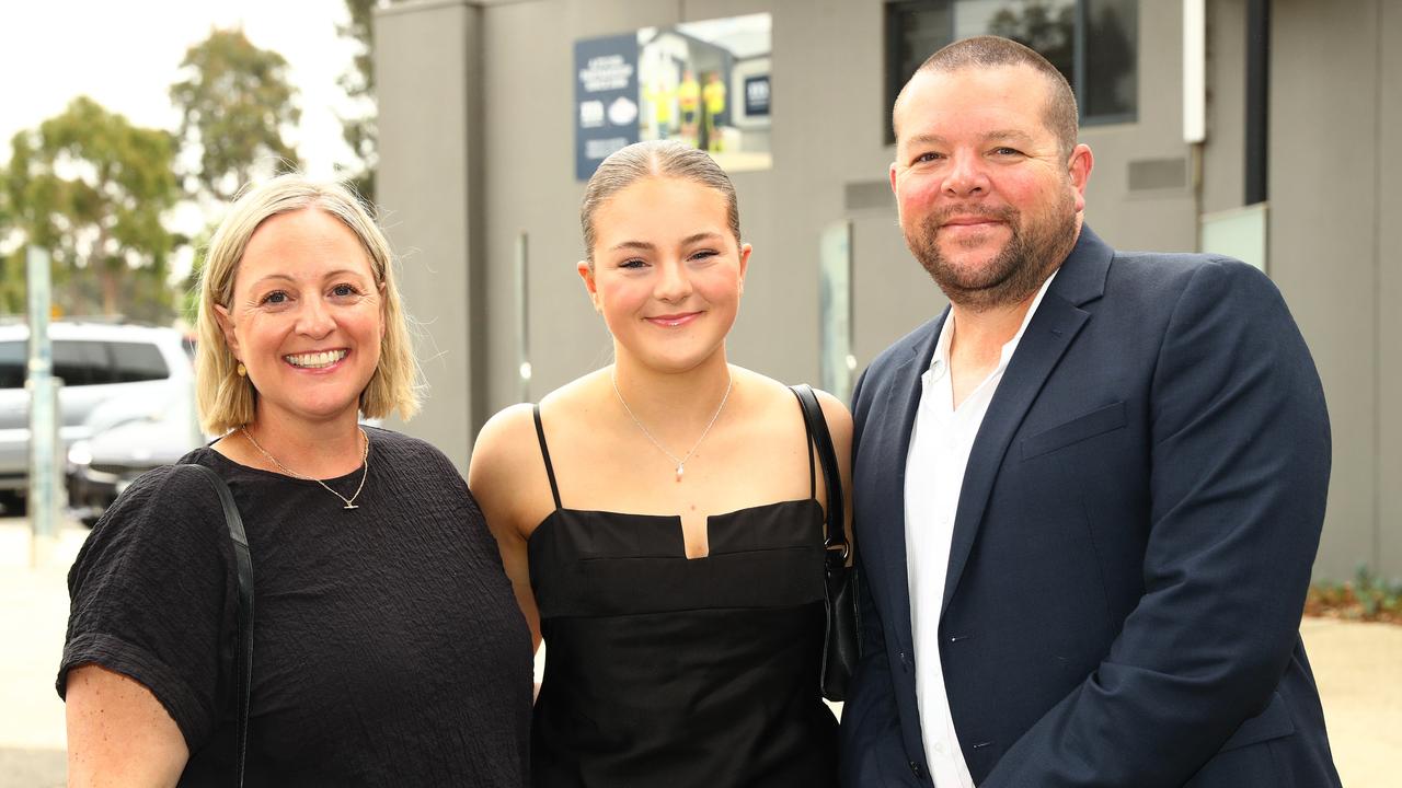 Mia Aspinall with parents Tamara and Simon at the Belmont High School year 12 graduation at GMHBA Stadium. Picture: Alison Wynd