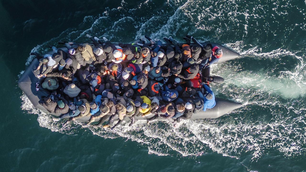 An inflatable dinghy with 65 migrants navigates the English Channel to Dover, marking the year’s busiest day for crossings. Picture: Dan Kitwood/Getty Images