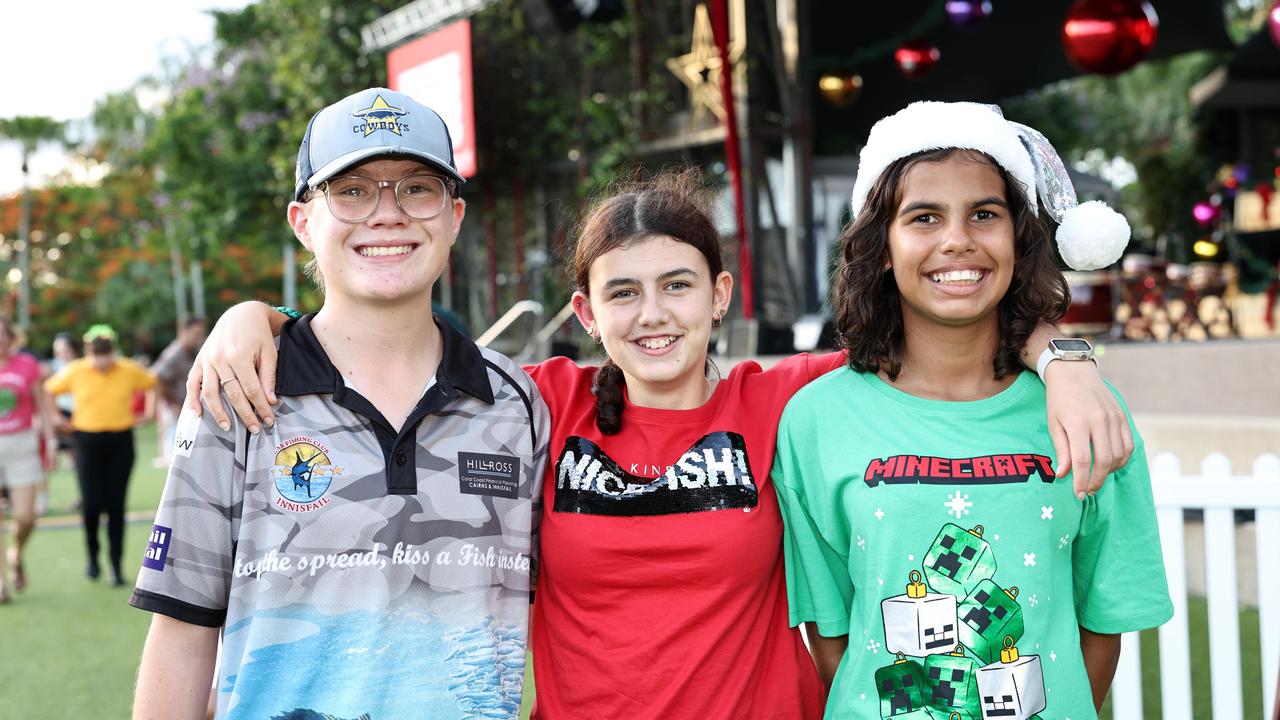 Noah Phillips, 14, Sienna Pearmine, 14, and Hannah Grainger, 12, at the Carols in the Park, held at Munro Martin Parklands. Picture: Brendan Radke