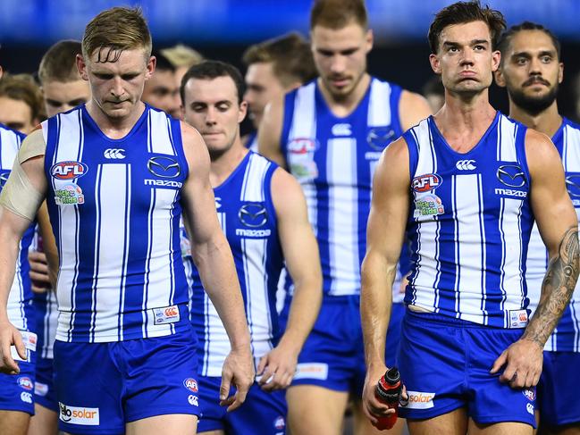 MELBOURNE, AUSTRALIA - APRIL 02: Jack Ziebell and his Kangaroos team mates look dejected after losing the round 3 AFL match between the North Melbourne Kangaroos and the Western Bulldogs at Marvel Stadium on April 02, 2021 in Melbourne, Australia. (Photo by Quinn Rooney/Getty Images)