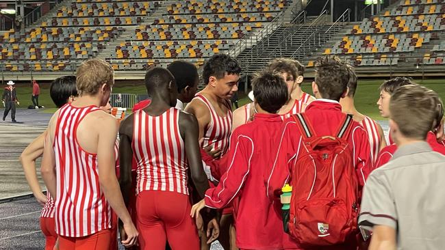 IGS's Israel Leoto is surrounded by teammates after the final event of the night.