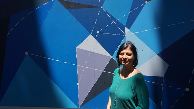 Bankstown Arts Centre director Vandana Ram with the Constellations mural for Night Sky, by Province Studio artists Laura Pike and Anne Louise Dadak. Picture: Antony Field