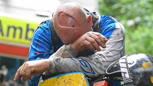 DEVASTATED: A trail-bike rider (pictured) struggles to hold back emotions after the loss of his mate at the Imbil State Forest today. Picture: Troy Jegers