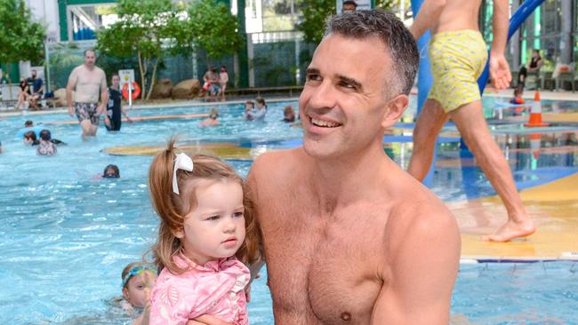 Peter Malinauskas at the pool with his daughter Eliza. Picture: Brenton Edwards