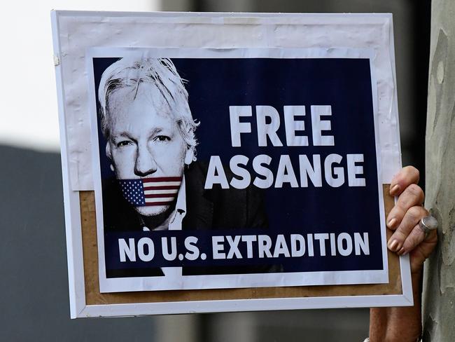 Protesters with placards gather during a rally in Martin Place, Sydney. Picture: AAP