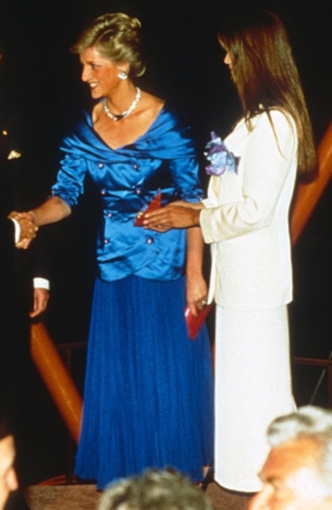 Diana makes a bold fashion statement at the Opera House next to model Elle Macpherson. Picture: Getty