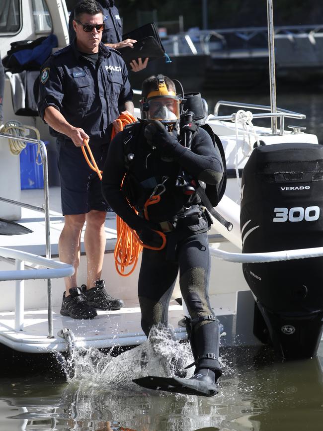 Police divers searching the Parramatta River on Thursday. Picture: John Grainger