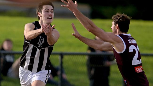 Zane Le Huray gets a handball away for Darley. Picture: Andy Brownbill