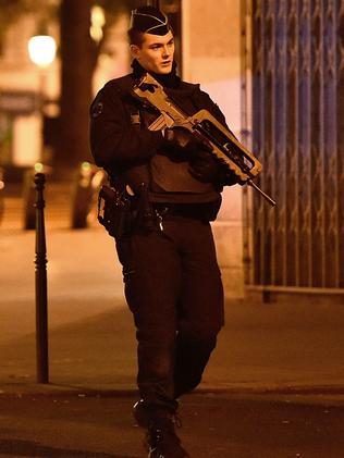 A military police officer patrols on Republique Square.