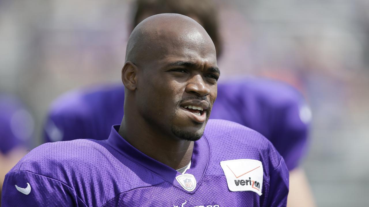 FILE - This July 31, 2014, file photo shows Minnesota Vikings running back Adrian Peterson during NFL football training camp in Mankato, Minn. The NFL suspended Adrian Peterson without pay for at least the remainder of the season. The league said Tuesday, Nov. 18, 2014, it informed the Minnesota Vikings running back he will not be considered for reinstatement before April 15 for violating the NFL personal conduct policy. (AP Photo/Charlie Neibergall, File)