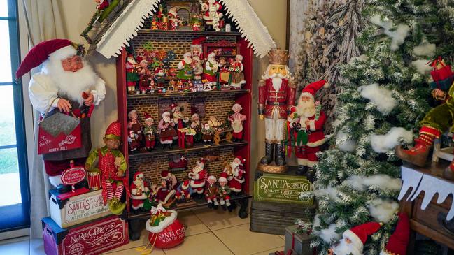 Walkerston grandmother Karen North has created a Christmas wonderland inside her home. On the left is a four-foot-tall Santa which she found in a Tasmanian shop while on holiday, and rearranged her luggage in order to take it home. Picture: Heidi Petith