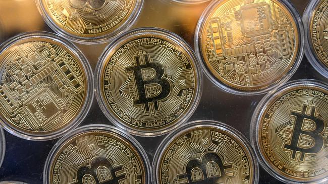 A US bank has been forced to sell off assets as a whopping $A11.6 billion in crypto was withdrawn from its accounts. Picture: Ozan Kose/AFP