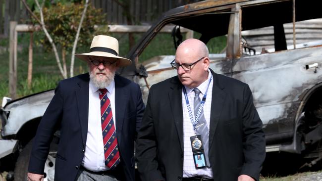 Coroner Donald MacKenzie (hat) and Andrew Massingham Detective Super Intendant at the scene where Police and Emergence services working on the Russell Island house fire that saw Wayne Godinet and 5 children die, Russell Island, Russell Island, on Wednesday 9th August 2023 – Photo Steve Pohlner