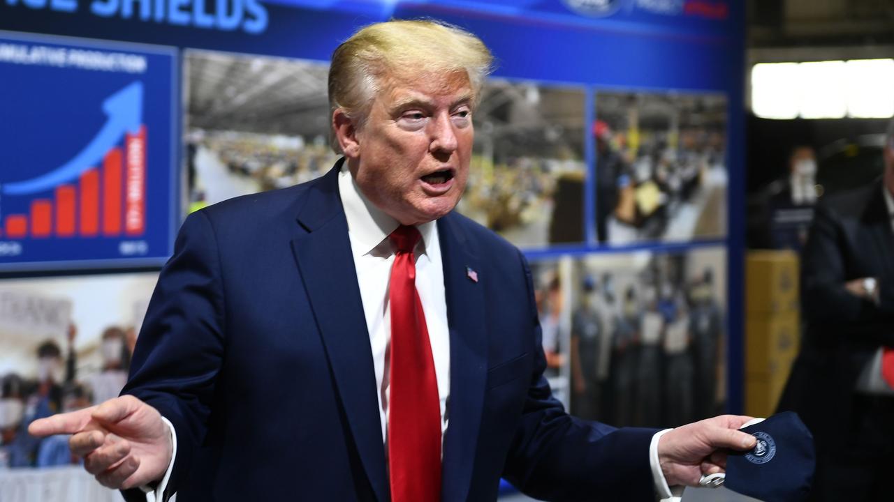 US President Donald Trump holds a mask during a tour of the Ford Plant in Rawsonville. Picture: Brendan Smialowski/AFP