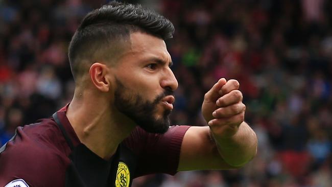 Manchester City's Argentinian striker Sergio Aguero celebrates after scoring the opening goal from the penalty spot during the English Premier League football match between Stoke City and Manchester City at the Bet365 Stadium in Stoke-on-Trent, central England on August 20, 2016. / AFP PHOTO / Lindsey PARNABY / RESTRICTED TO EDITORIAL USE. No use with unauthorized audio, video, data, fixture lists, club/league logos or 'live' services. Online in-match use limited to 75 images, no video emulation. No use in betting, games or single club/league/player publications. /