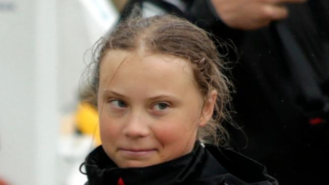 Swedish climate activist Greta Thunberg, 16, arrives in the US after a 15-day journey crossing the Atlantic in the Malizia II, a zero-carbon yacht, on August 28, 2019 in New York. - "Land!! The lights of Long Island and New York City ahead," she tweeted early Wednesday. She later wrote on Twitter that her yacht had anchored off the entertainment district of Coney Island in Brooklyn to clear customs and immigration. (Photo by Kena Betancur / AFP)