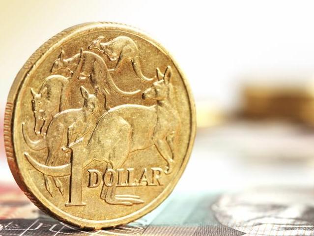 Aussie one dollar coins, on a twenty dollar note.