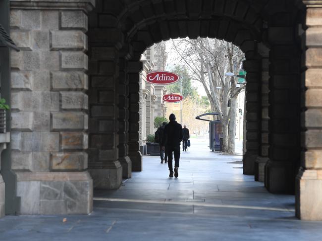 A small number of people walking past the Town Hall on King William St on Wednesday morning. Picture: Tricia Watkinson