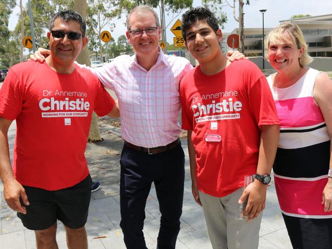 NSW opposition leader Michael Daley and Rivestone candidate Annemarie Christie with supporters at Stanhope Village Shopping Centre in December.