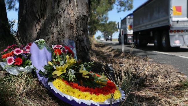 A floral tribute to teacher Melissa Bond who was killed on Appin Rd in March this year.