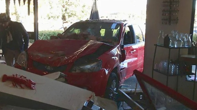 A car lost control at the Kerferd Rd intersection in 2013 and ploughed into the window of a nearby cafe.